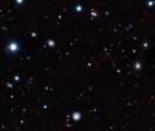 Record de distance pour un amas de galaxies évolué